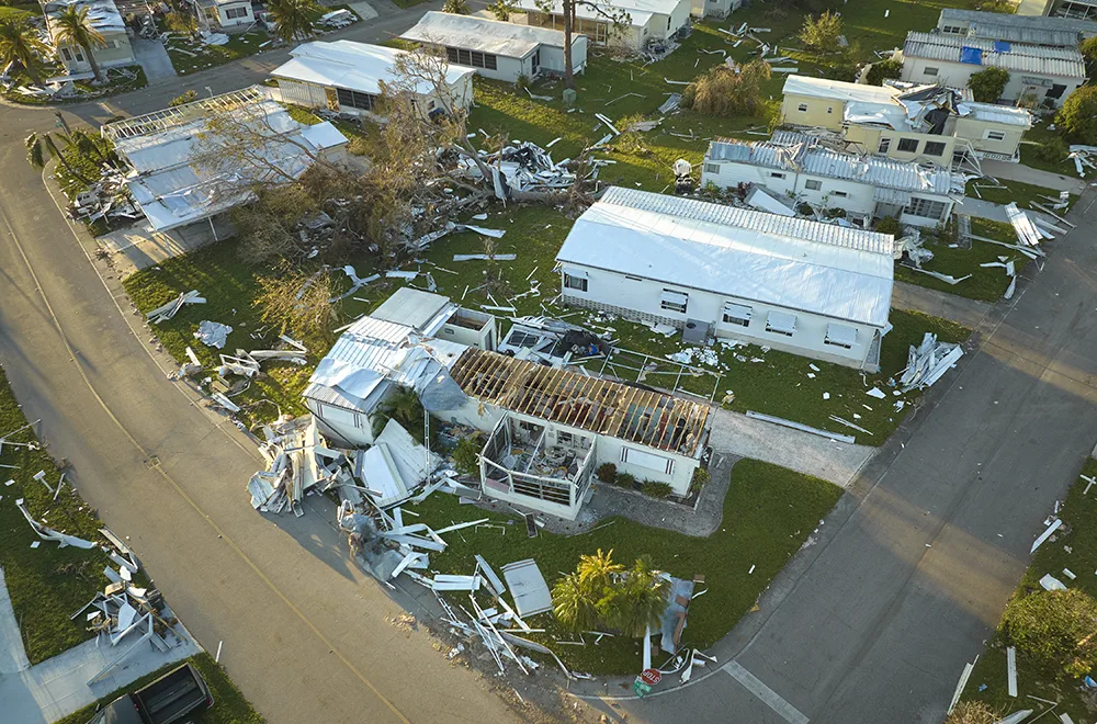 residential-tornado-damage a lot of houses damaged due to a tornado with house roofs blown off