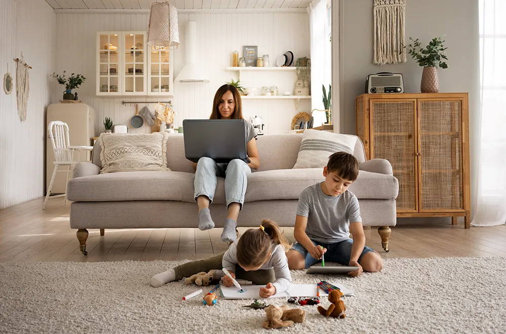a mother sitting with her kids in their lounge