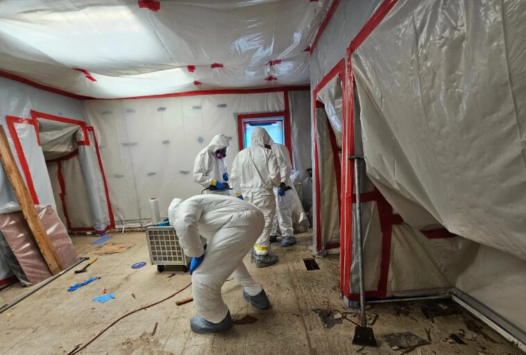 Sealed plastic containment barrier for asbestos abatement