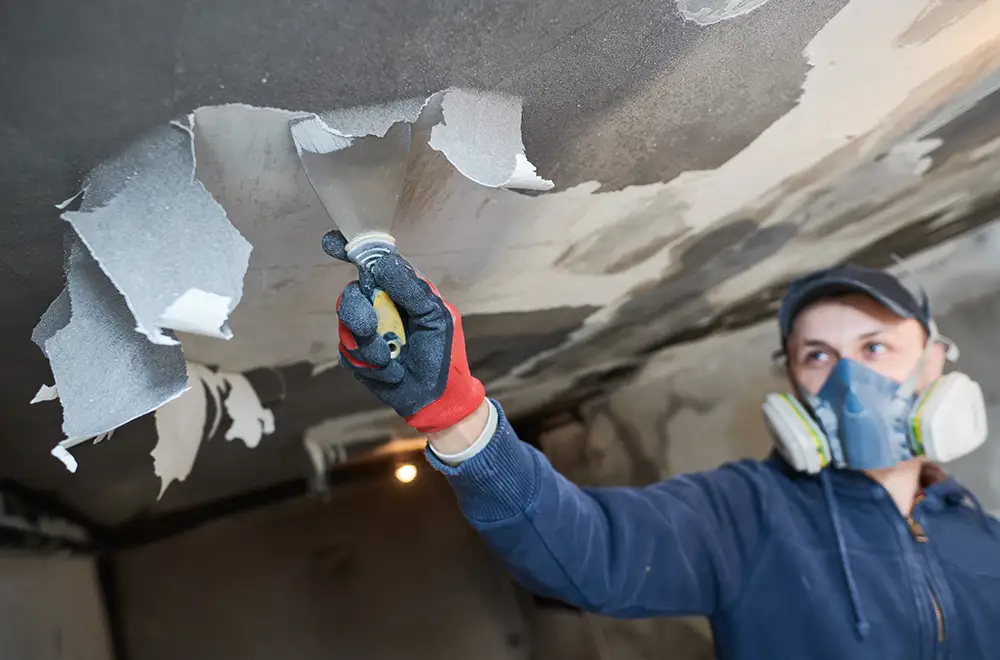 a worker restoring a house