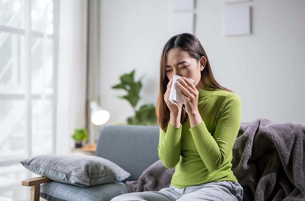 a woman battling with allergies